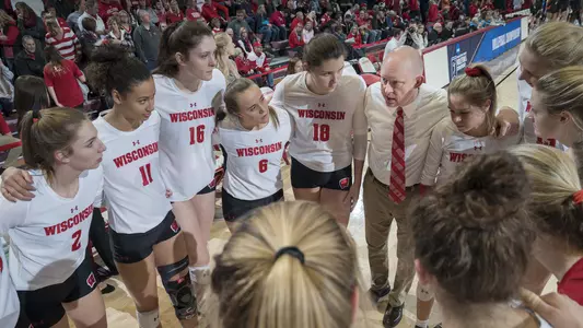 Volleyball team huddle with Kelly Sheffield in NCAA match vs. Pepperdine 2018