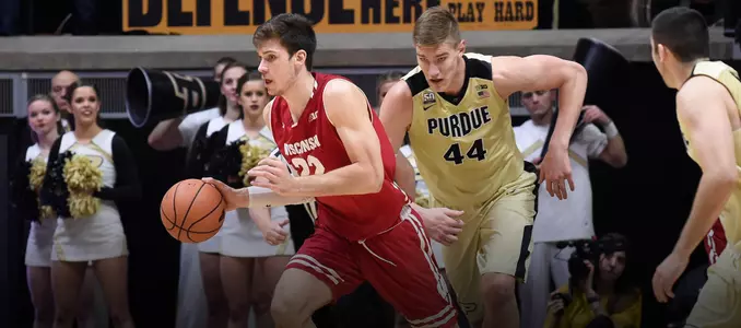 Ethan Happ dribbles the basketball during a game at Purdue