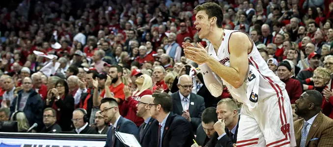 Ethan Happ cheers on teammates from the bench during a game against Purdue