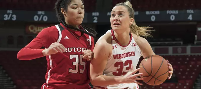 Courtney Fredrickson drives to the basket against a Rutgers defender.