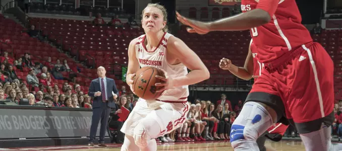 Kendra Van Leeuwen drives to the basket against a Rutgers defender.