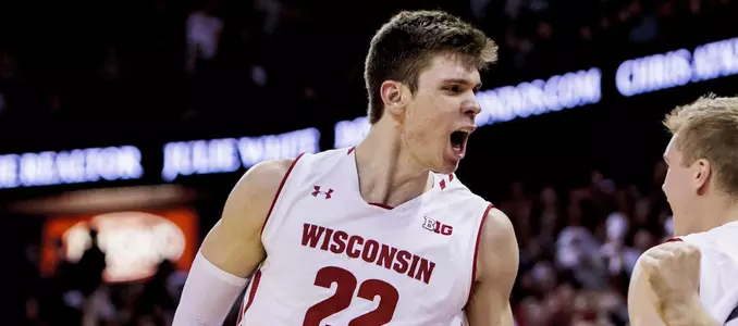 MADISON, WI - FEBRUARY 15: Wisconsin Badger forward Ethan Happ (22) celebrates with teammates as they seal the game at the free throw line during an college basketball game between Purdue Boilermakers and the Wisconsin Badgers on February 15th, 2018 at the Kohl Center in Madison, WI. Wisconsin upset the Purdue Boilermakers 57-53. (Photo by Dan Sanger/Icon Sportswire)
