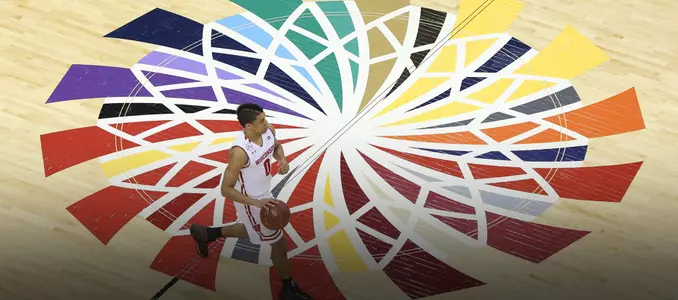 D'Mitrik Trice dribbles the ball up the court during a Big Ten tournament game