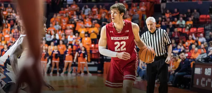 Ethan Happ handles the basketball during a game at Illinois
