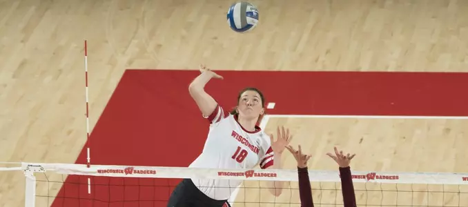 Danielle Hart attacks the ball against a Loyola blocker.