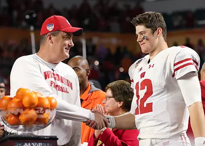 Head coach Paul Chryst and Alex Hornibrook post-game celebration 2017 Orange Bowl football vs. Miami