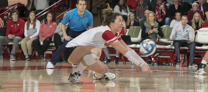 Molly Haggerty goes to her knees to dig a ball.