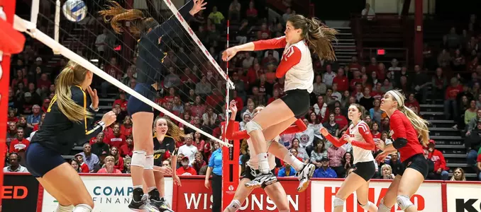 Danielle Hart attacks the ball past a Marquette blocker.
