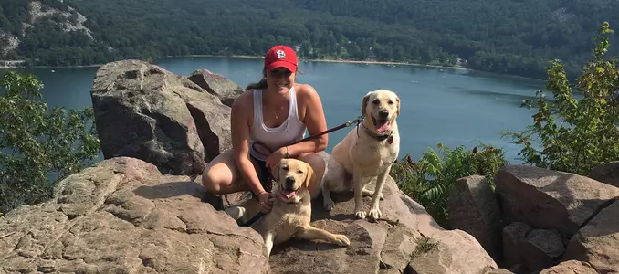 Lauren Williams women's hockey Occupaws volunteer work with dogs at Devils Lake