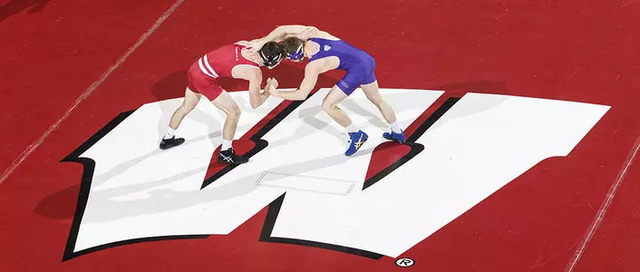 Wrestling vs. Northern Iowa overhead photo of two wrestlers on Wisconsin mat 2016-2017