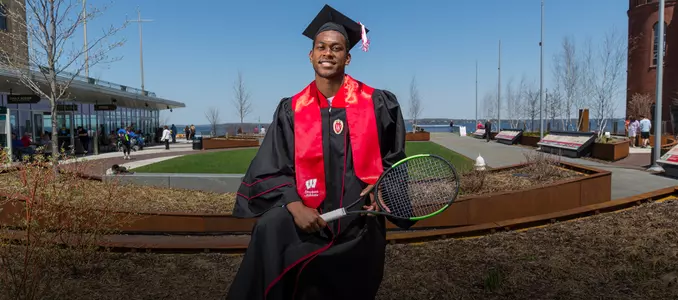 Lamar Remy poses for a graduation photo at Alumni Park on the campus of UW-Madison