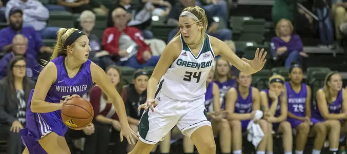 Alex Luehring defends against a Whitewater player