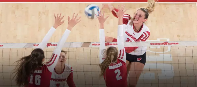 Grace Loberg attacks the ball against Dana Rettke and Sydney Hilley