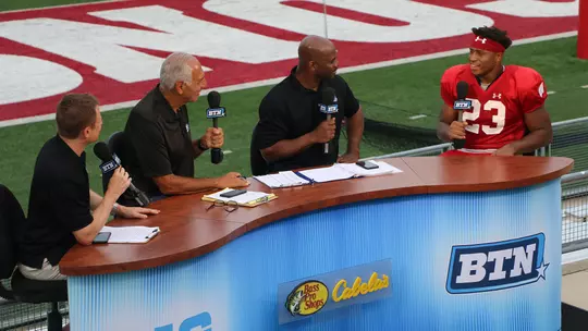 Big Ten Network analysts at football practice 2018 interviewing Jonathan Taylor
