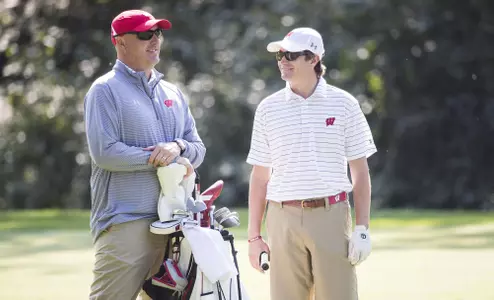 Wisconsin Badgers Head Coach Michael Burcin talks to golfer Eddie Wajda of the men's golf team during day 2 of the Badger Invitational Golf Tournament at University Ridge Golf Course Monday, September 11, 2017, in Verona, Wis. (Photo by David Stluka)