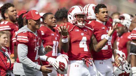 A.J. Taylor (4) and Wisconsin Badgers teammates celebrate a turnover during an NCAA college football game against the New Mexico Lobos Saturday, September 8, 2018, in Madison, Wisconsin. The Badgers won 45-14. (Photo by David Stluka)