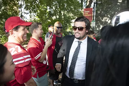 Wisconsin Badgers teammates walk through the Camp Randall Arch prior to an NCAA college football game against the Western Kentucky Hilltoppers Friday, August 31, 2018, in Madison, Wisconsin. The Badgers won 34-3. (Photo by David Stluka)