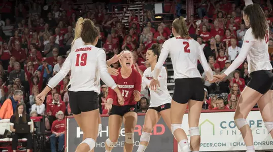 The Badgers celebrate a point on the court.