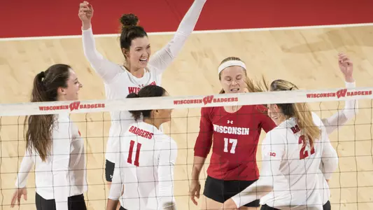 The Badgers celebrate a point on the court.