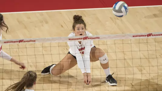 M.E. Dodge goes to one knee to save a ball.