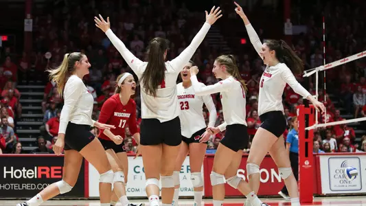 The Badgers celebrate a point on the court.