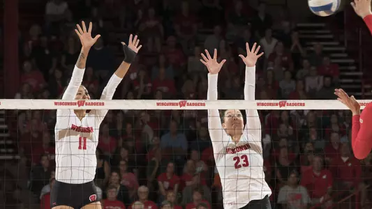 Tionna Williams and Molly Haggerty go up for a block against an Ohio State player.
