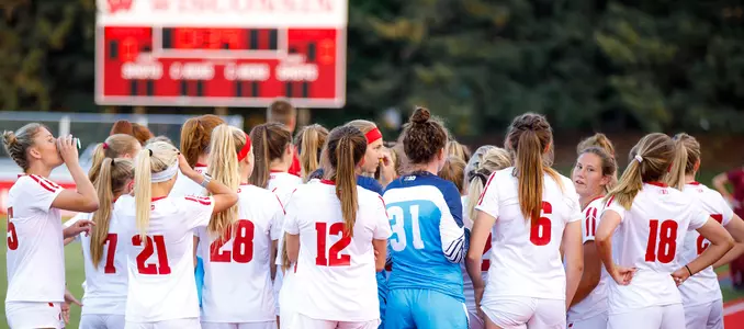Women's soccer team huddle