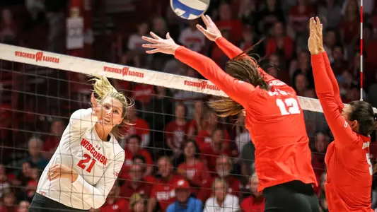 Grace Loberg attacks the ball against an Ohio State blocker.