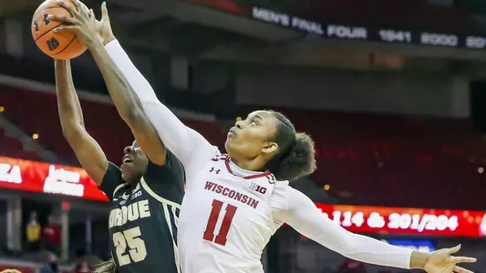 Marsha Howard blocks a shot by a Purdue player.