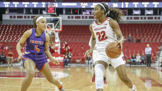 Niya Beverley drives around an Evansville defender.