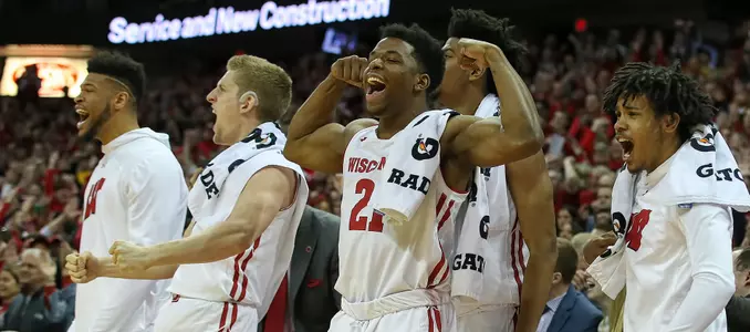 Khalil Iverson and the Wisconsin bench react to a play during a game against Michigan