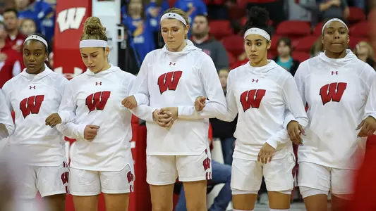 The Badgers line up during the national anthem