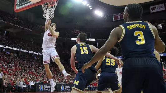 Ethan Happ scores a lay-up basket against Michigan at the Kohl Center on Saturday, Jan. 19, 2019