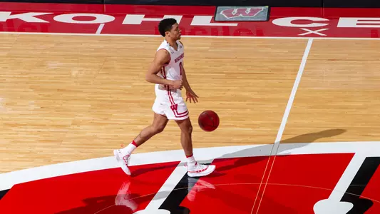 D'Mitrik Trice dribbles down the court during a game vs. Michigan