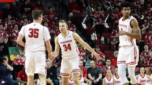 Brad Davison and Nate Reuvers celebrate against Nebraska