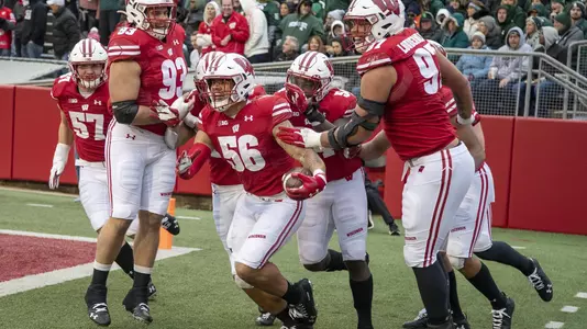 Wisconsin Badgers Zack Baun and teammmates celebrate a pick six during an NCAA Big Ten Conference college football game against the Michigan State Spartans Saturday, Oct. 12, 2019, in Madison, Wis. (Photo by David Stluka/Wisconsin Athletic Communications)