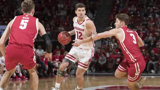 Trevor Anderson dribbles the ball during the 2019 men's basketball Red/White Scrimmage