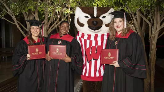 Wisconsin Athletics December 2019 Graduation Reception - Bucky Badger with three graduating women student-athletes