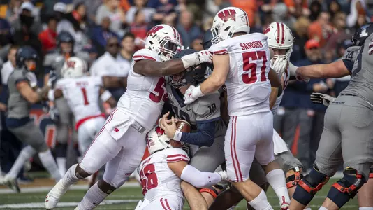 Wisconsin Badgers linebackers Jack Sanborn (57), Zack Baun (56) and Chris Orr (54) sack Illinois Fighting Illini quarterback Brandon Peters (18) during an NCAA Big Ten Conference college football game Saturday, Oct. 19, 2019, in Champaign, Ill. The Fighting Illini won 24-23. (Photo by David Stluka/Wisconsin Athletic Communications)
