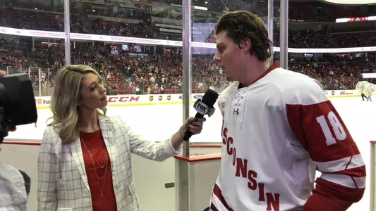 Owen Lindmark is interviewed by a television report during a period break of Wisconsin men's hockey vs. Minnesota Duluth, Oct. 18, 2019 at the Kohl Center.
