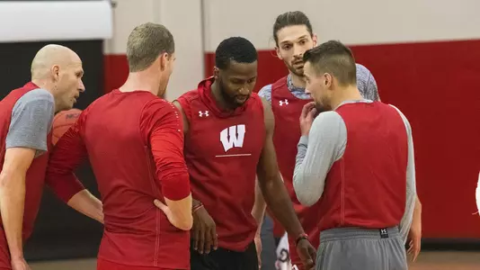 Alando Tucker at men's basketball practice with fellow alumni