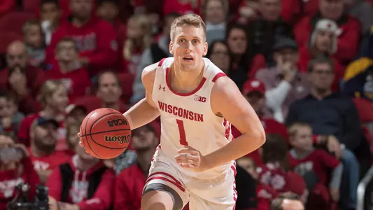 Brevin Pritzl dribbles the ball up court during the Red/White Scrimmage