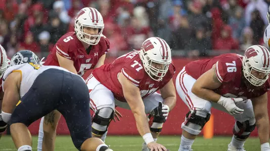 Graham Mertz (5) and Blake Smithback (77) Wisconsin Badgers football offense vs. Kent State 2019
