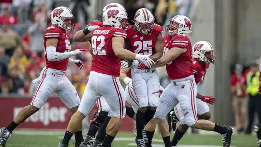 Wisconsin Badgers defensive back Eric Burrell (25) celebrates an interception with teammates during an NCAA Big Ten Conference college football game against the Michigan Wolverines Saturday, Sept. 21, 2019, in Madison, Wis. The Badgers won 35-14. (Photo by David Stluka/Wisconsin Athletic Communications)
