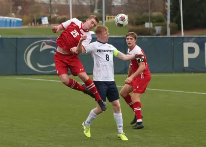 Ben Lead goes up for header against Penn State player