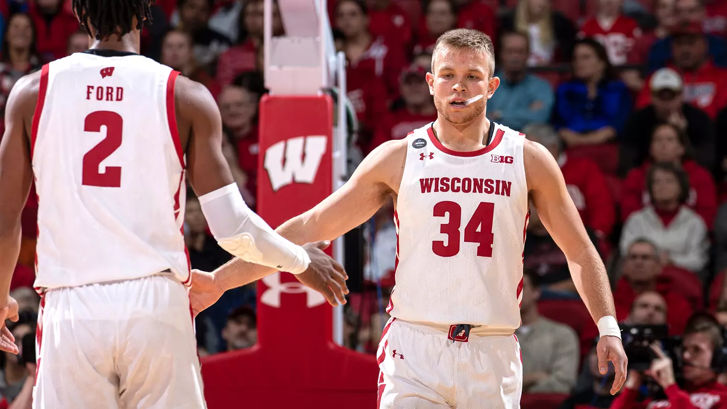 Brad Davison high-fives Aleem Ford during a game vs. Eastern Illinois
