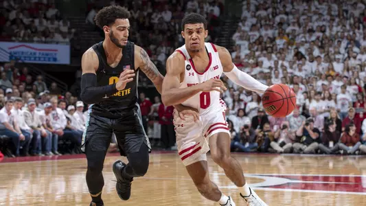 Wisconsin Badgers Guard D'Mitrik Trice (0) handles the ball during an NCAA college basketball game against the Marquette Golden Eagles Sunday, Nov. 17, 2019, in Madison, Wis. The Badgers won 77-61. (Photo by David Stluka/Wisconsin Athletic Communications)