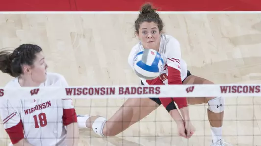 M.E. Dodge goes low for a dig.