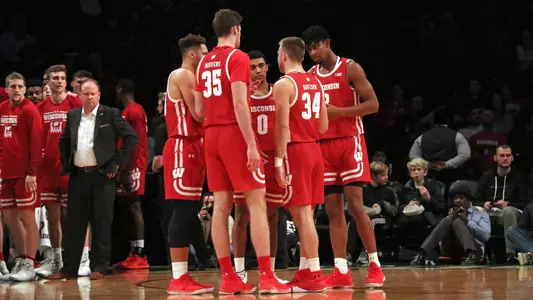 Badgers huddle before a game with Richmond