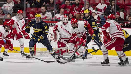 Wisconsin Badgers' defenseman Ty Emberson (21) takes on Michigan during an NCAA menÕs hockey game Sunday December 1, 2019 in Madison, Wisconsin.Photo by Tom Lynn/Wisconsin Athletic Communications
